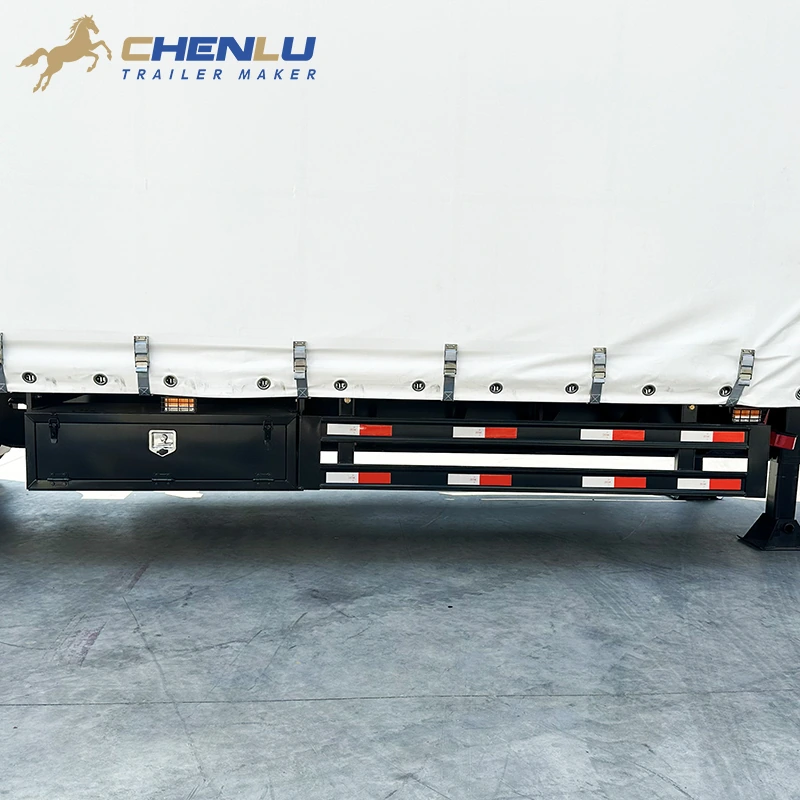 Lockable toolbox beside the reflective side guard below the curtain rail